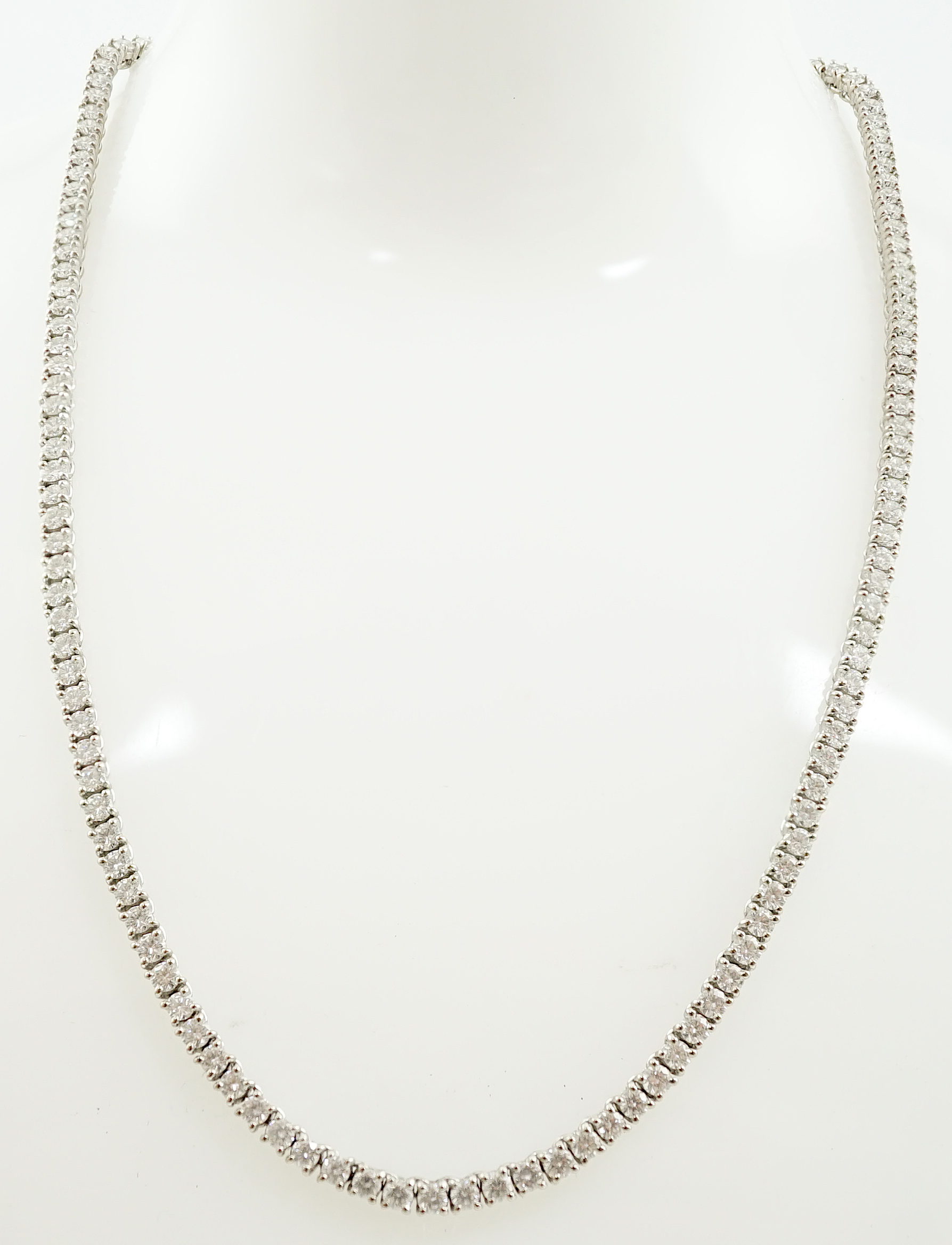 A modern Cartier 18ct white gold and diamond line choker necklace, with Cartier box and certificate dated 14/3/03